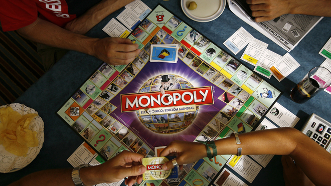 Players participate in a Guinness world record attempt taking place across the world for the largest simultaneous game of Monopoly, at a hotel in Madrid